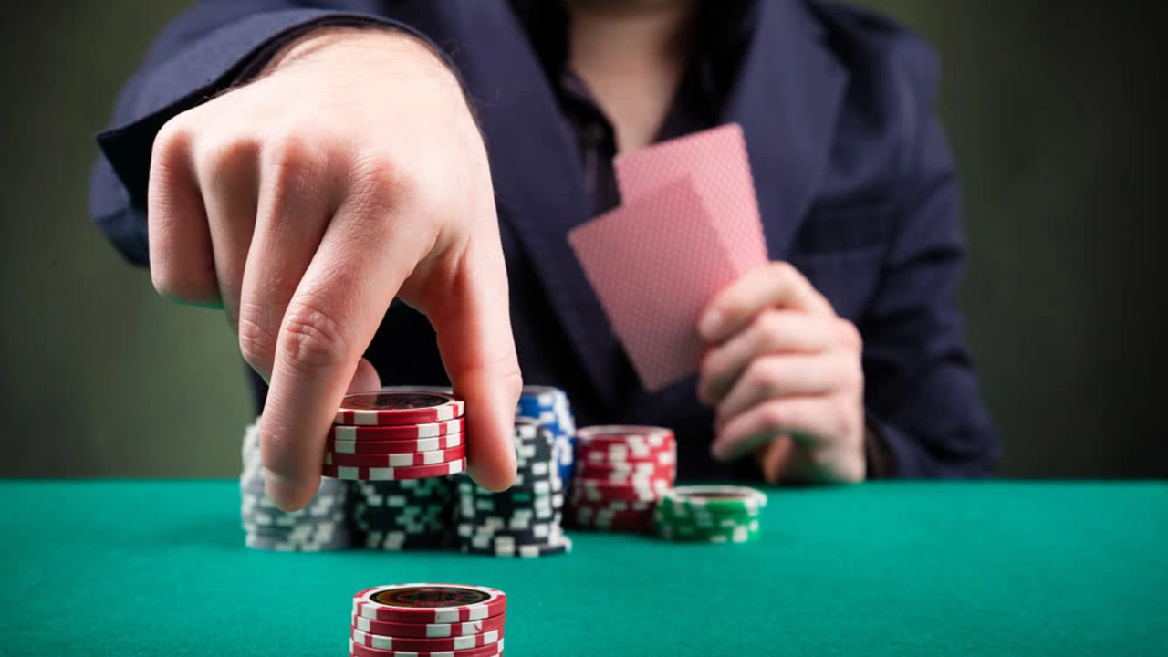 What is a “dealer” in poker games, and how does it work?